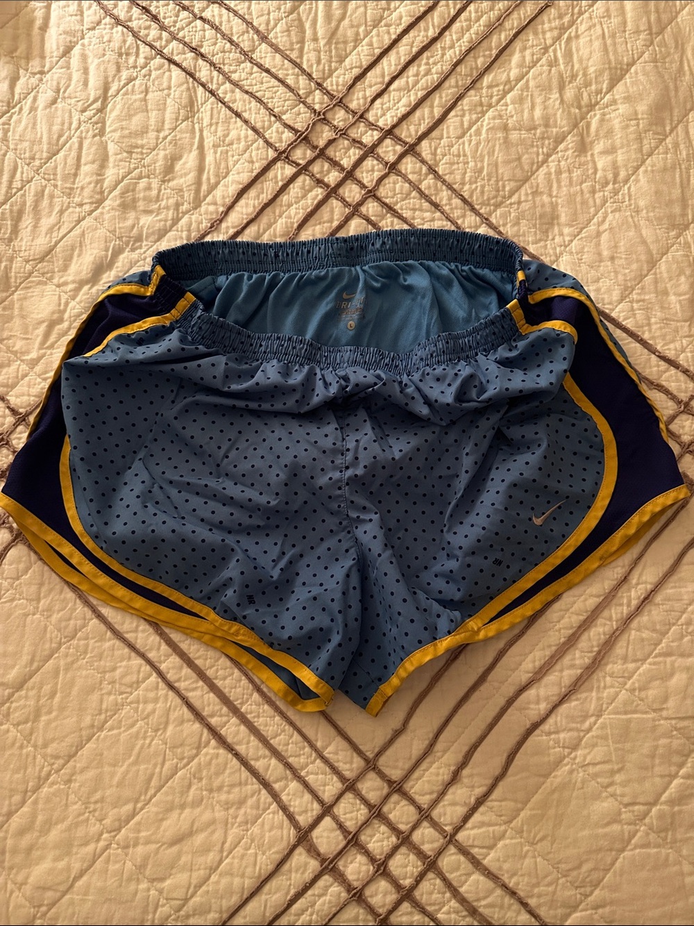Nike Women’s Light Blue Athletic Shorts with Yellow Trim